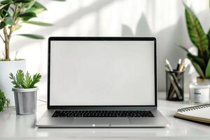 Writing and Work Setup with Laptop Mockup and Open Notebook on White Desk Background photo