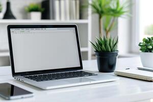 Laptop Mockup with White Desk and Open Notebook for   Writing and Work Setup photo