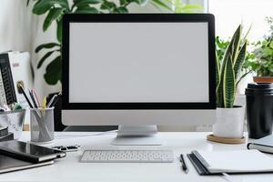 White Desk with Computer Mockup Notebooks and Pens for Writing and Editing photo