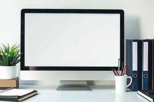 Computer Mockup on White Desk with Notebooks and Pens for Writing and Editing photo