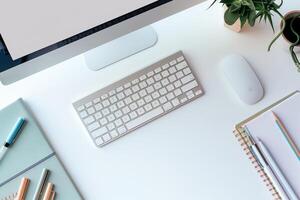 Computer Mockup on White Desk with Notebooks and Pens for Productive Writing and Editing photo