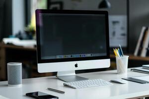 Computer Mockup with Notebooks and Pens on White Desk for Seamless Writing and Editing photo