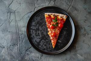 Single Slice of Pizza with Toppings on   Plate with Textured Background photo