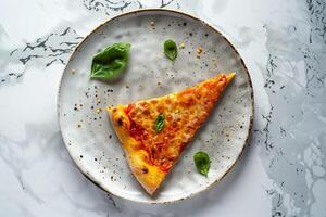 Single slice of pizza with assorted toppings on a white textured plate background photo