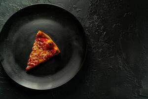 Single slice of pizza with toppings textured plate background photo