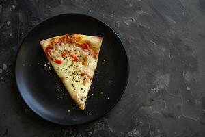 Single pizza slice with various toppings plate with a textured background photo