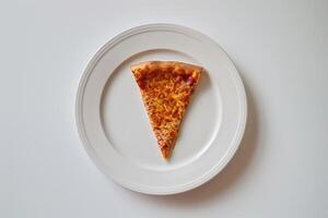 Desktop   with a slice of pizza on a white plate photo