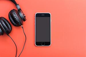 Mobile phone mockup with screen and headphones in a tech driven background photo