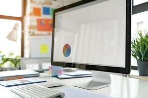 Computer Mockup on a White Desk with Marketing Materials for a High Resolution Office Environment photo