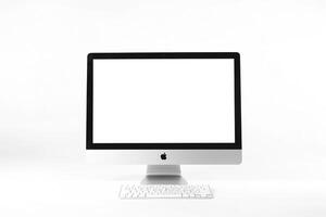 Computer Monitor Mockup with White Screen on Glossy Surface photo