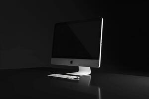 Computer Monitor Mockup on a Glossy Background with a   High Resolution Display photo