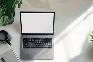 Overhead   of Laptop Mockup Background on a White Desk Featuring Sleek   Design photo