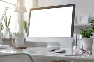 Computer Mockup on a White Desk with Tech Gadgets Around Background photo