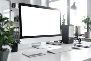 Computer Mockup on a White Desk Surrounded by Various Tech Gadgets photo