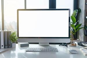 Computer Mockup on a White Desk with Various Tech Gadgets and Accessories photo