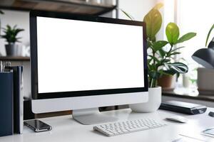 Computer Mockup on a White Desk with Various Tech Gadgets and Accessories photo