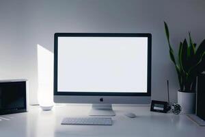 Computer Mockup on a White Desk with Tech Gadgets and Electronic Components photo
