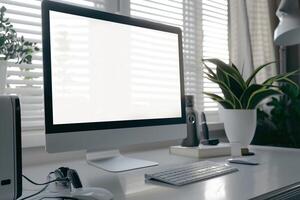 Computer Mockup on a White Desk with Tech Gadgets and Various Electronic Components photo