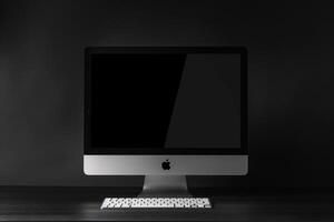 Desk with Computer Monitor Mockup Featuring Blank Screen for Tech Projects photo