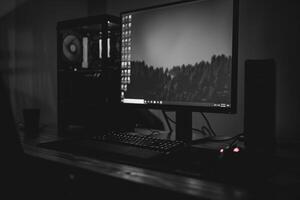 Noir Inspired Desktop Computer Mockup with Deep Black Background photo