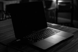 Noir Laptop Mockup with Dark Glossy Surface and High Tech Appeal photo
