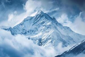 Snow Capped Mountain Peak at Dawn with Mist and Majestic Winter Landscape in a Scenic photo