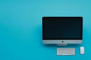 Desktop computer mockup with blank screen on neutral background photo