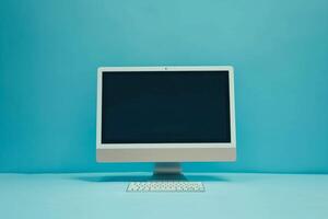 Desktop computer mockup with blank screen on neutral toned background photo