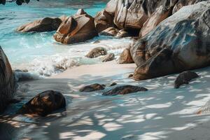 Pristine beach on Seychelles Island with turquoise waters and rugged granite boulders photo