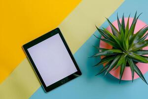 Tablet Screen Mockup in Lime Green Studio with Potted Plant   Background photo
