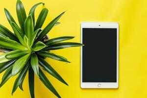 Tablet Screen Mockup with Lime Green Studio and Potted Plant Professional Look photo