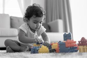 Baby Playing with Building Blocks Happy and  ful Background photo