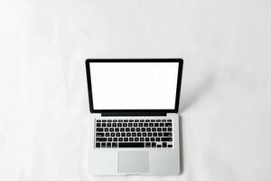 Laptop Mockup with Blank Screen on White Surface Perfect for Business Presentations photo