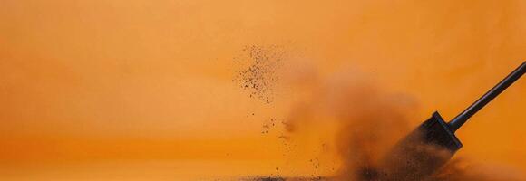 Dust Removal With Broom Against Vibrant Orange Background During Cleaning Process photo