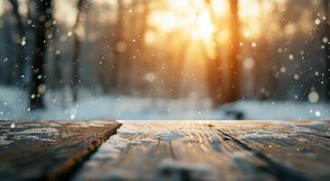 Sunset Over Snowy Forest With Falling Snowflakes on Wooden Table in Winter photo