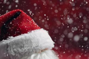 Red Winter Hat With Pom Pom Surrounded by Snowflakes in Cozy Indoor Setting photo