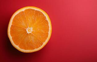 Orange Slice on Red Background photo