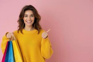 Woman Holding Shopping Bags and Pointing Right photo