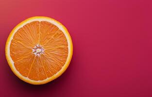 Orange Slice on Red Background photo
