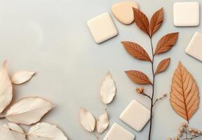 Green Leaves on Beige Paper Background photo