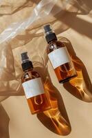 Amber Bottles With Blank Labels on Fabric photo
