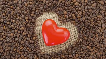 Aromatic coffee beans. Roasted coffee with a heart shape in the middle. Coffee lovers concept video