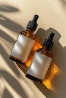 Two Amber Spray Bottles On Beige Background photo