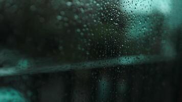 Window with condensate or steam after heavy rain, large texture or background. Wood table top on rain drops on clear window video