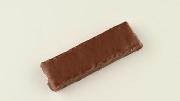 Chocolate bar on a white background isolate video