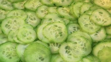 Many cucumbers are thinly sliced. video