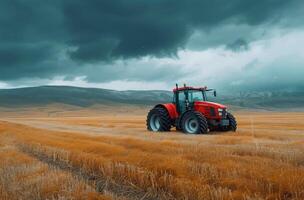 Red Tractor in a Field After Harvest photo
