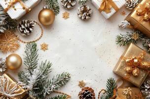 Gold Christmas Gifts and Evergreen Branches on Snowy White Background photo