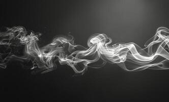 Abstract White Smoke Flowing on a Black Background photo