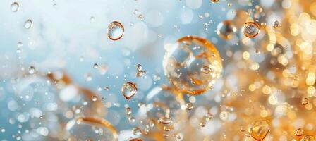 Golden Water Droplets Falling on a Blue Background photo